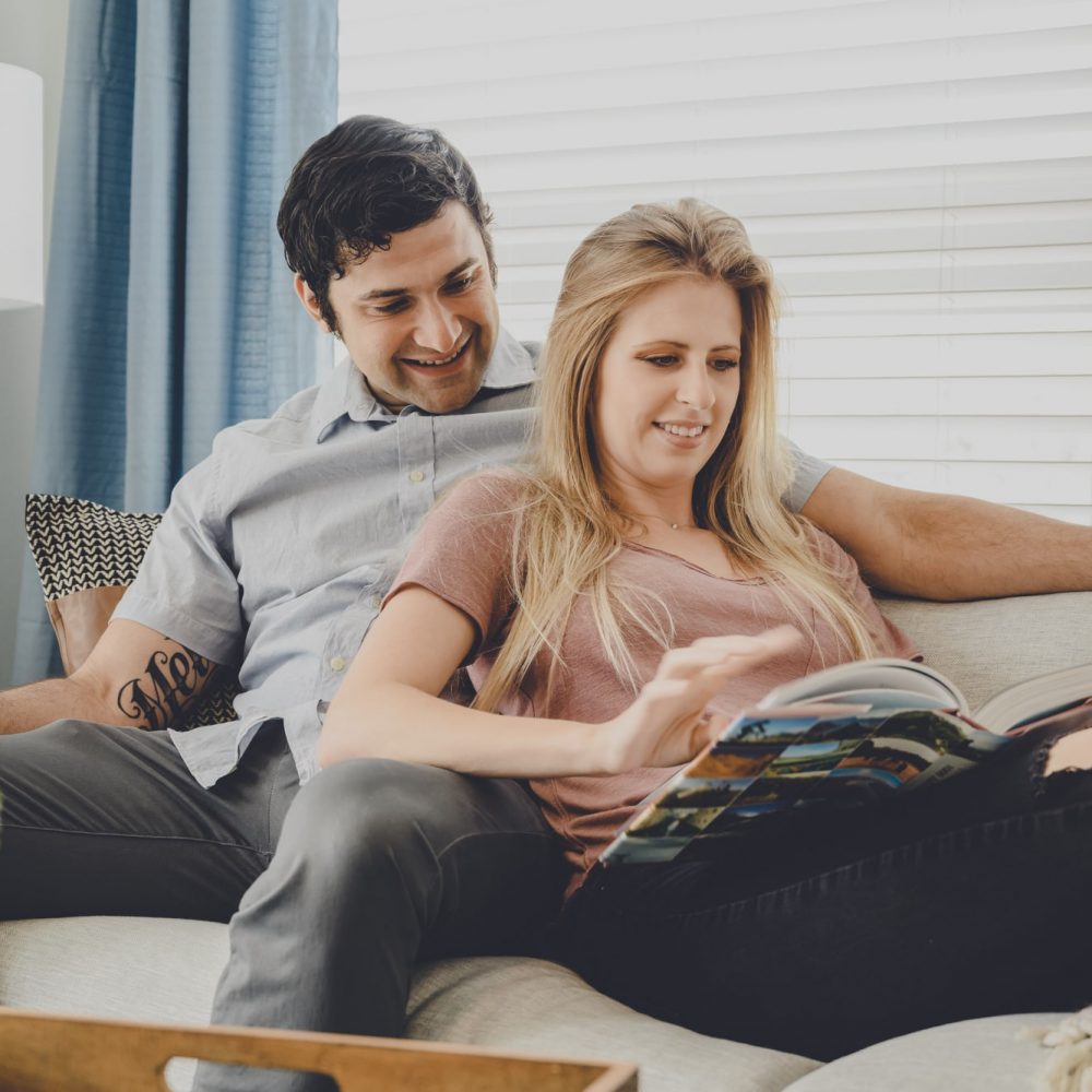 Luxury Apartments Denver - Couple Relaxing in DECO Apartments Living Room