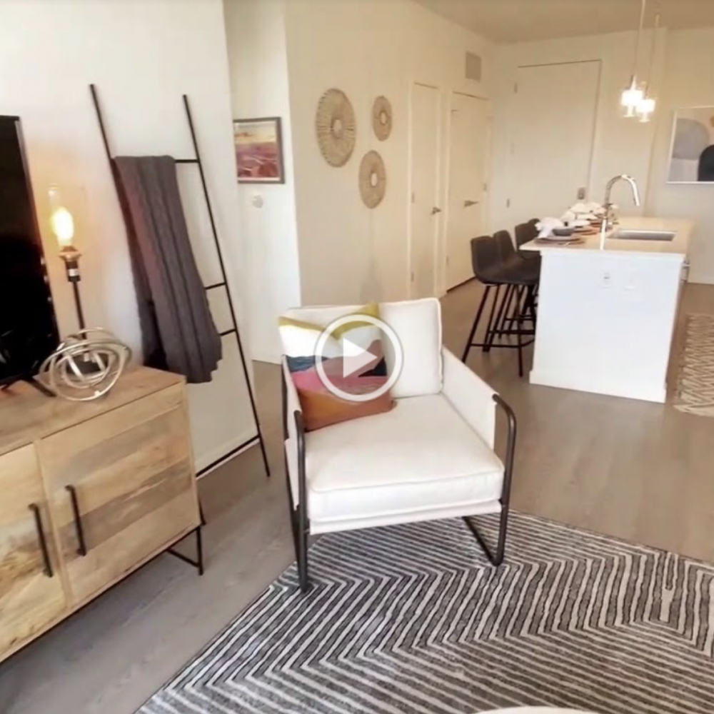 Armchair next to the TV set on the wooden dresser